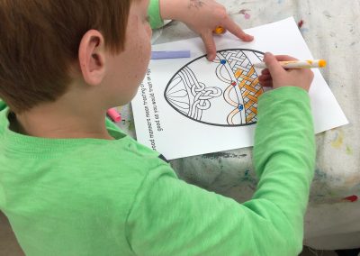 A child coloring at a Being Aware Event